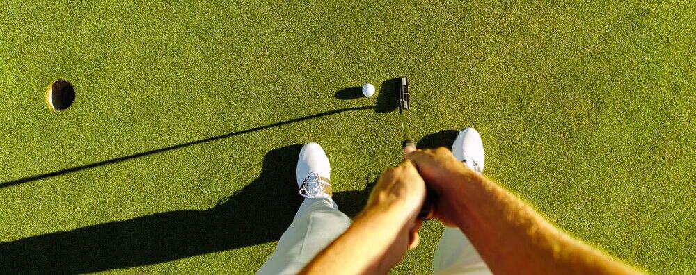 A person putting on one of the golf courses near Emerald Isle.